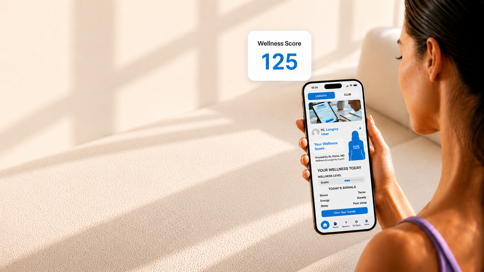A woman checking her Longivy Health Score on her phone