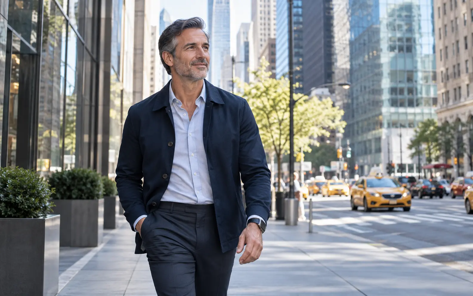 A healthy professional man taking a purposeful walk in a busy city